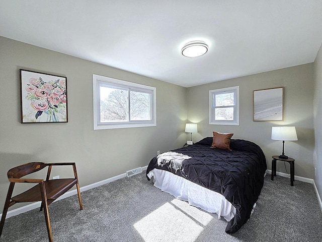 bedroom featuring visible vents, baseboards, and carpet floors