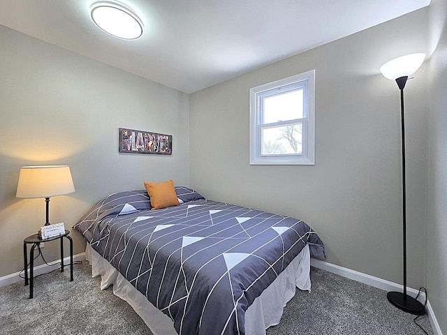 carpeted bedroom with baseboards