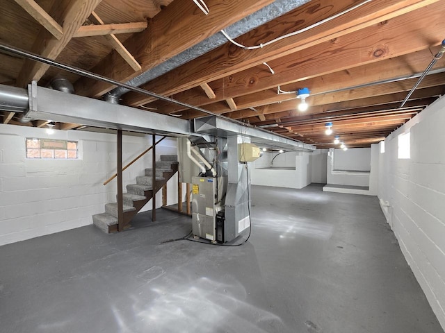 basement with stairway and heating unit