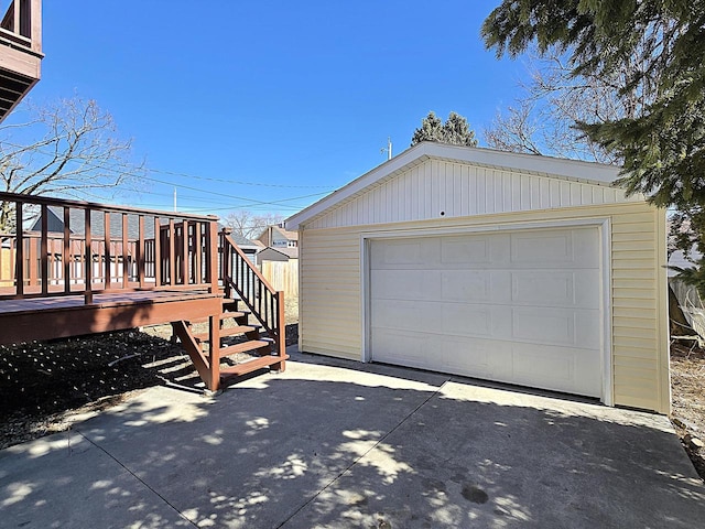 detached garage featuring driveway