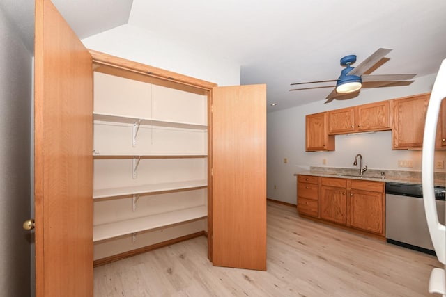 kitchen with light wood-type flooring, a ceiling fan, a sink, light countertops, and dishwasher