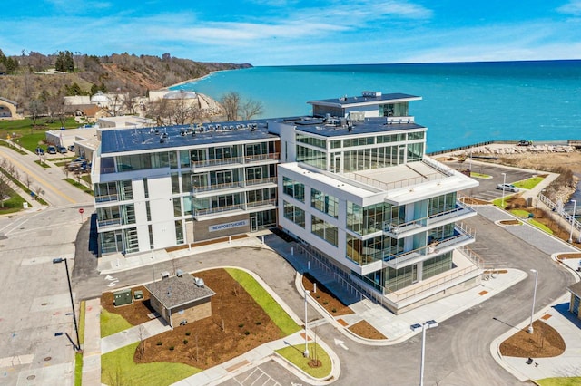 birds eye view of property with a water view