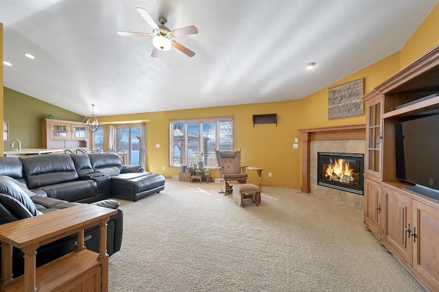 living area featuring a ceiling fan, recessed lighting, lofted ceiling, light colored carpet, and a tile fireplace