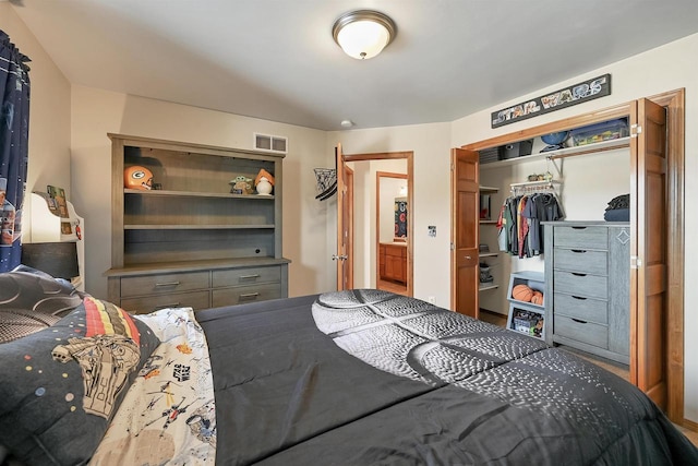 bedroom featuring visible vents and a closet