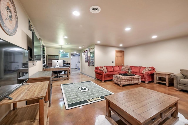 living room with visible vents, recessed lighting, and finished concrete floors