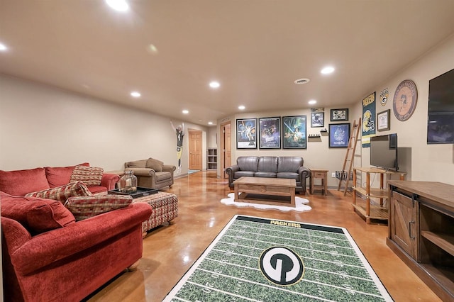 living area with recessed lighting and concrete floors