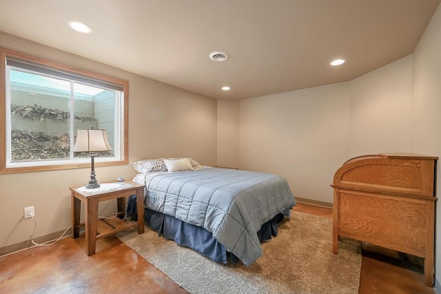 bedroom with visible vents, recessed lighting, concrete floors, and baseboards