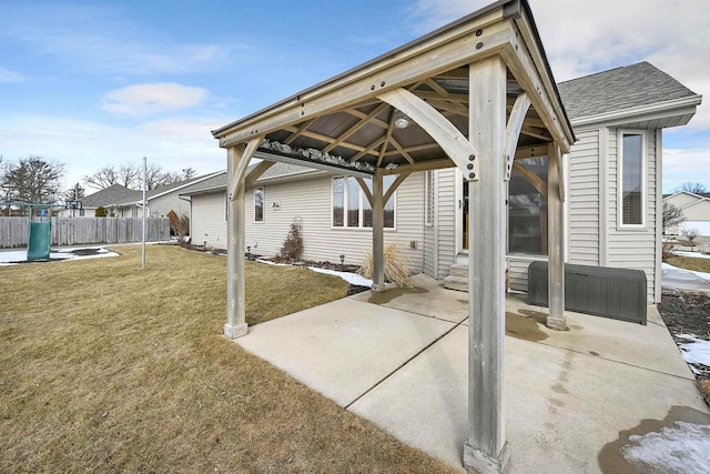 view of patio / terrace with a gazebo, entry steps, and fence