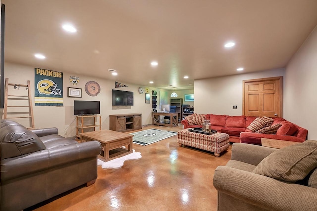 living room featuring recessed lighting and concrete flooring