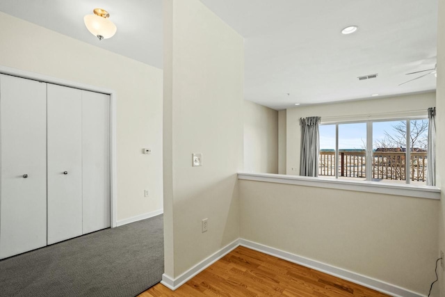 interior space with visible vents, recessed lighting, baseboards, and wood finished floors