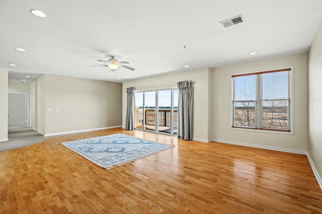 interior space featuring light wood finished floors, visible vents, recessed lighting, and baseboards