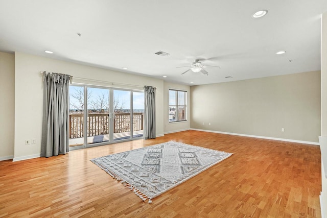 living area with recessed lighting, visible vents, baseboards, and light wood-style floors