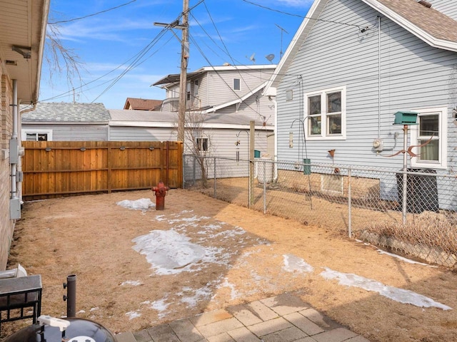 view of yard featuring cooling unit and fence