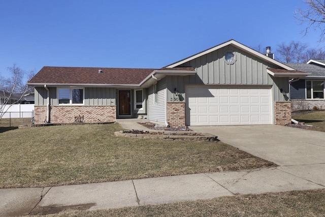 view of front facade featuring a garage, brick siding, and a front lawn