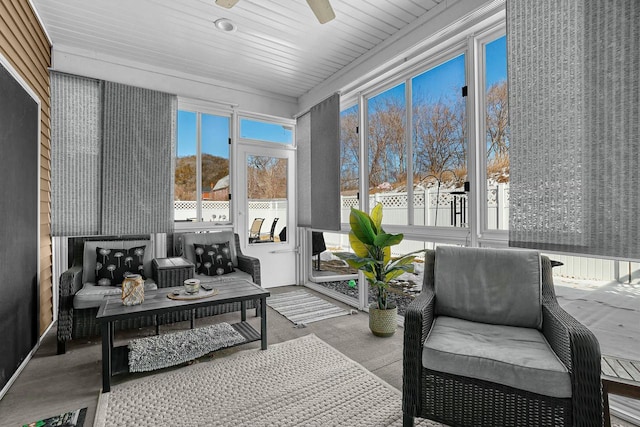 sunroom featuring ceiling fan