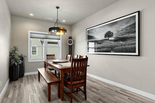 dining area with visible vents, recessed lighting, baseboards, and wood finished floors