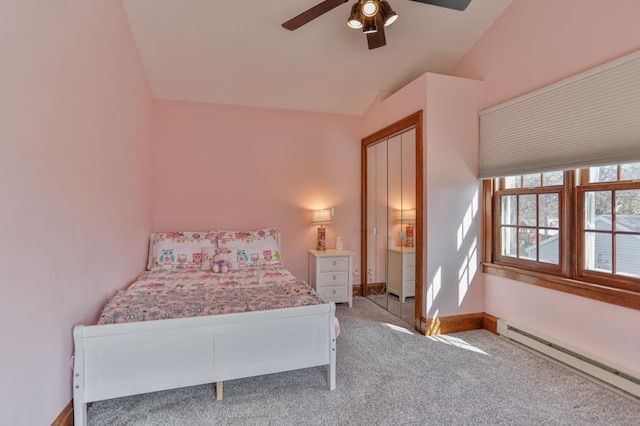 bedroom featuring a ceiling fan, baseboards, lofted ceiling, light carpet, and baseboard heating