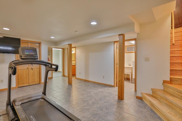 exercise room featuring recessed lighting, baseboards, and a sink