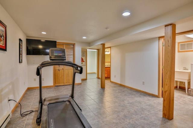 exercise area with a baseboard heating unit, recessed lighting, baseboards, and visible vents