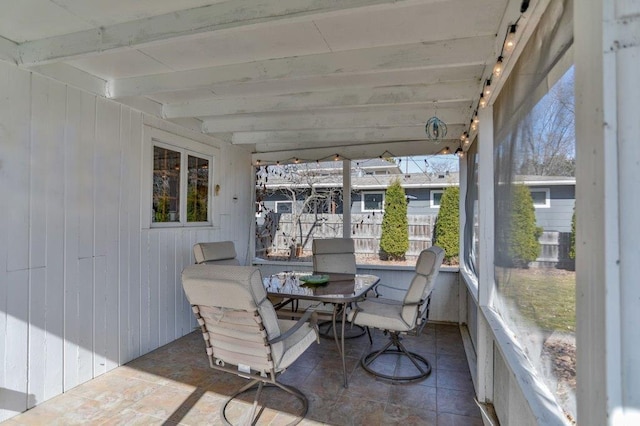 sunroom / solarium with beam ceiling