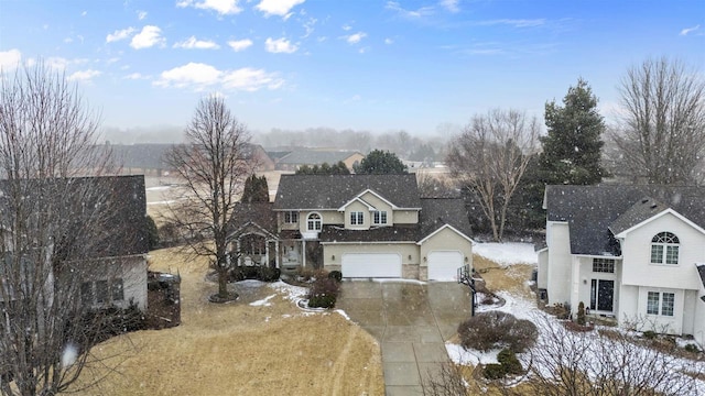 traditional-style home featuring driveway and a garage