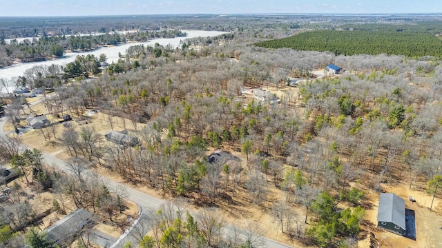 bird's eye view featuring a wooded view