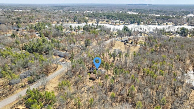 bird's eye view featuring a wooded view