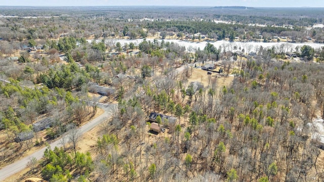 drone / aerial view featuring a view of trees