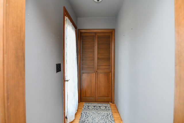 hallway featuring light wood-style flooring