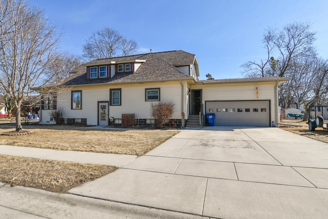 view of front of house with concrete driveway and a garage