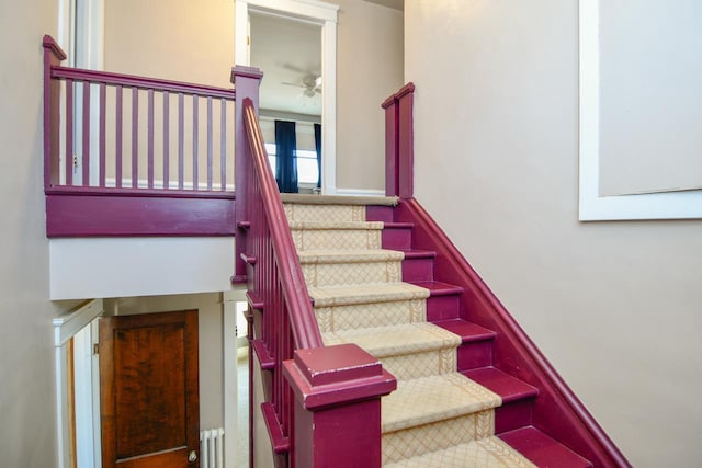 stairway with ceiling fan