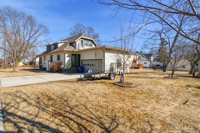 view of front facade with a garage, driveway, and roof with shingles