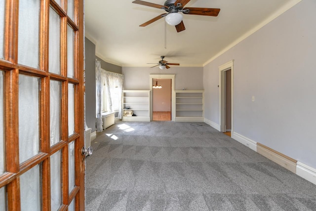 interior space featuring baseboards and ceiling fan