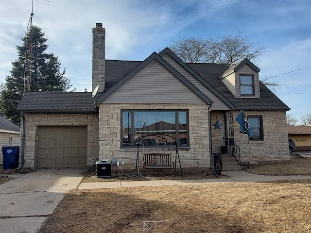 view of front facade with an attached garage, central AC unit, driveway, and roof with shingles