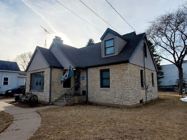 view of front of property with roof with shingles