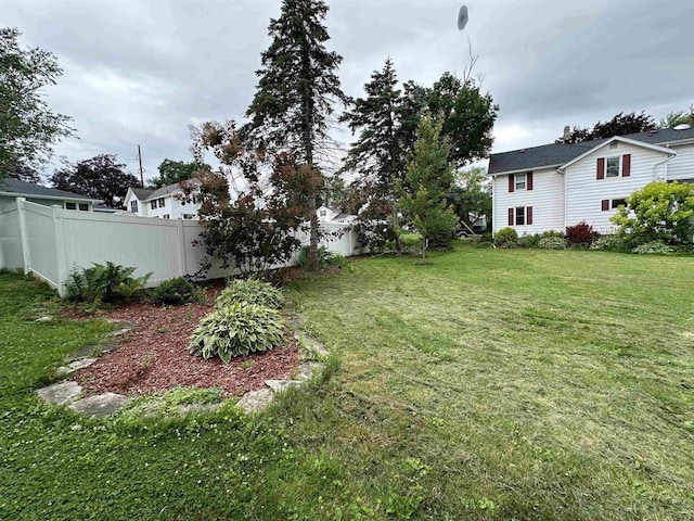 view of yard featuring fence