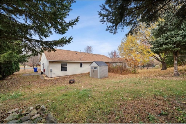 rear view of property with an outdoor structure and a storage unit