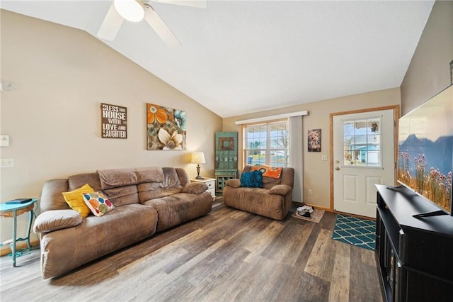 living room with a ceiling fan, lofted ceiling, wood finished floors, and baseboards