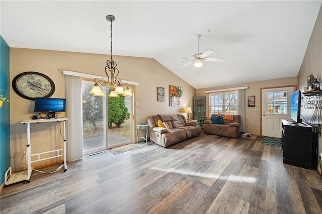 living room featuring ceiling fan with notable chandelier, lofted ceiling, and wood finished floors