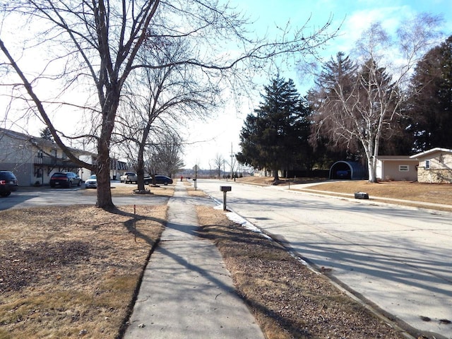 view of street featuring sidewalks and curbs