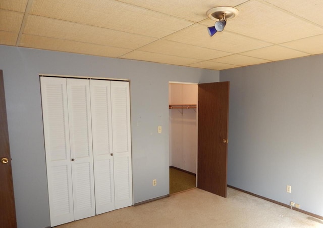 unfurnished bedroom featuring visible vents, baseboards, and carpet floors