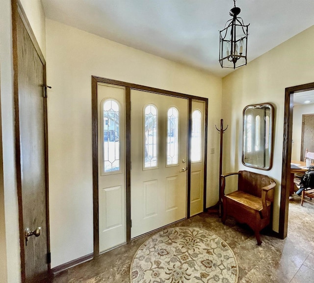 entryway featuring an inviting chandelier