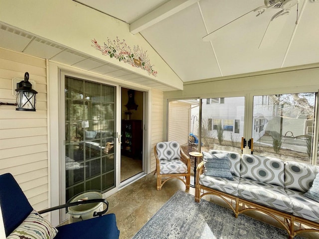 sunroom featuring lofted ceiling with beams