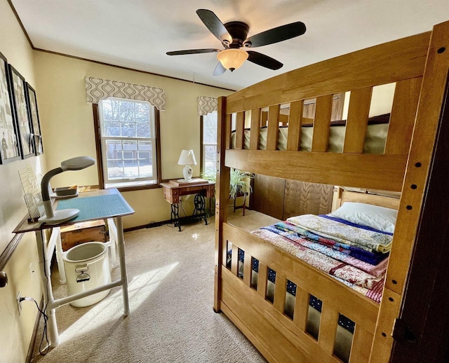 bedroom with baseboards, a ceiling fan, and crown molding