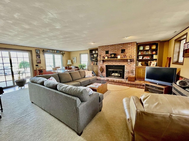 living room featuring built in features, carpet flooring, a fireplace, and a textured ceiling