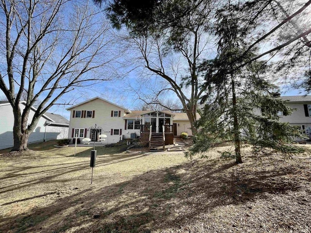 back of property featuring a sunroom