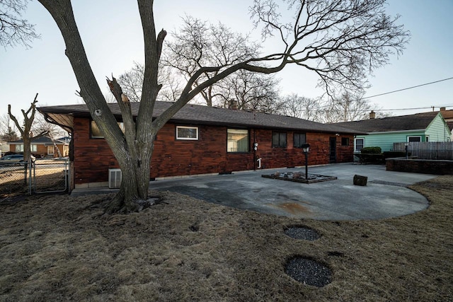 exterior space featuring central air condition unit and fence