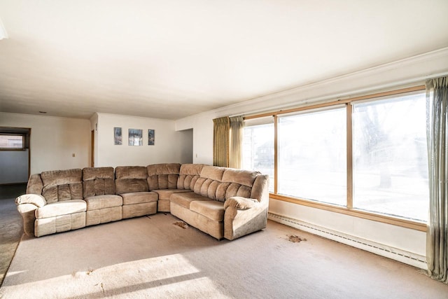 living area featuring baseboard heating, carpet floors, and ornamental molding