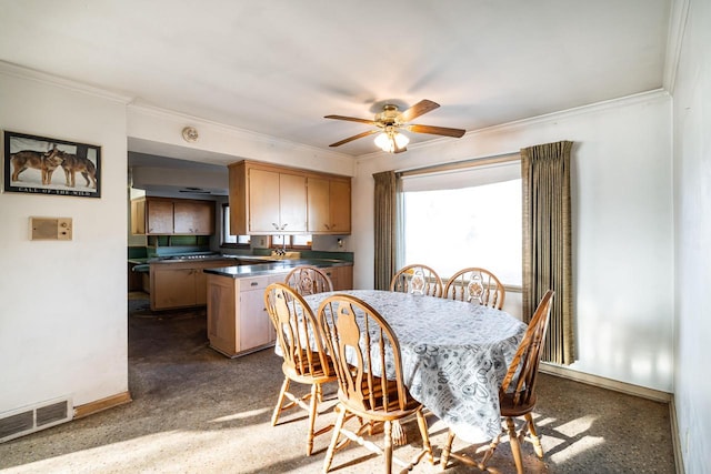 dining area featuring visible vents, crown molding, and baseboards