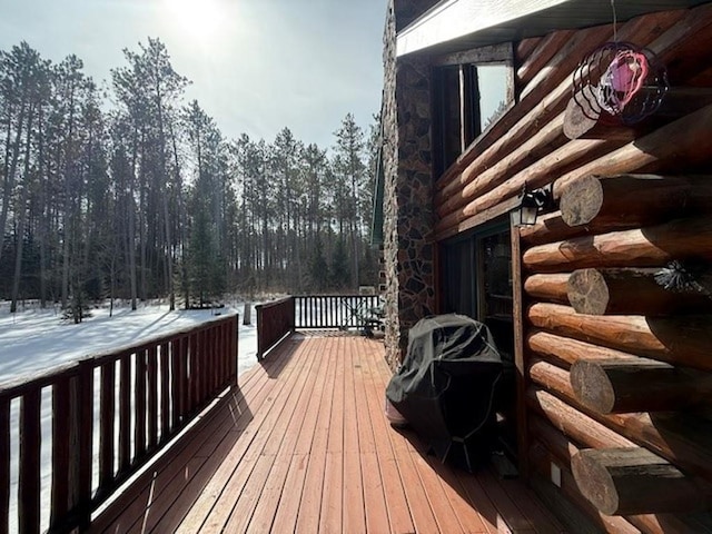 view of snow covered deck